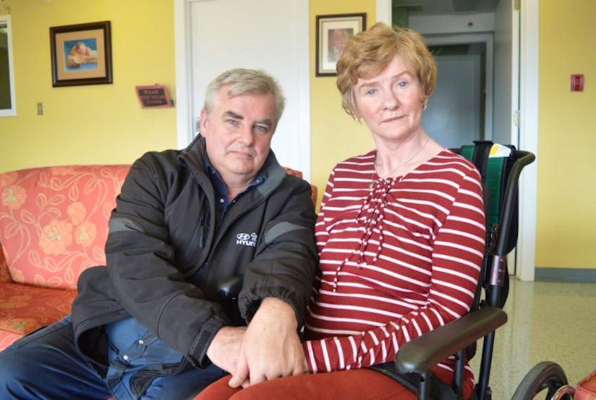 Darrell Campbell spends some time with his wife Judy at Seaview Manor nursing home in Glace Bay. Campbell said the horrors of Huntington disease have torn his family apart.
