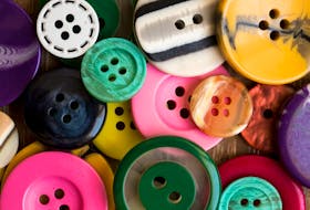 Buttons have become a rare and precious commodity for a group of Cape Breton seamstresses making masks for frontline workers. Stock Image