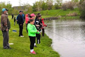 People are seen at Collierylands Park in New Waterford during the New Waterford Fish and Game Association fishing derby last year.