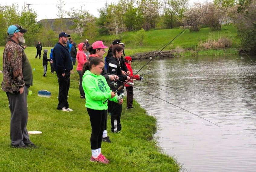 People are seen at Collierylands Park in New Waterford during the New Waterford Fish and Game Association fishing derby last year.
