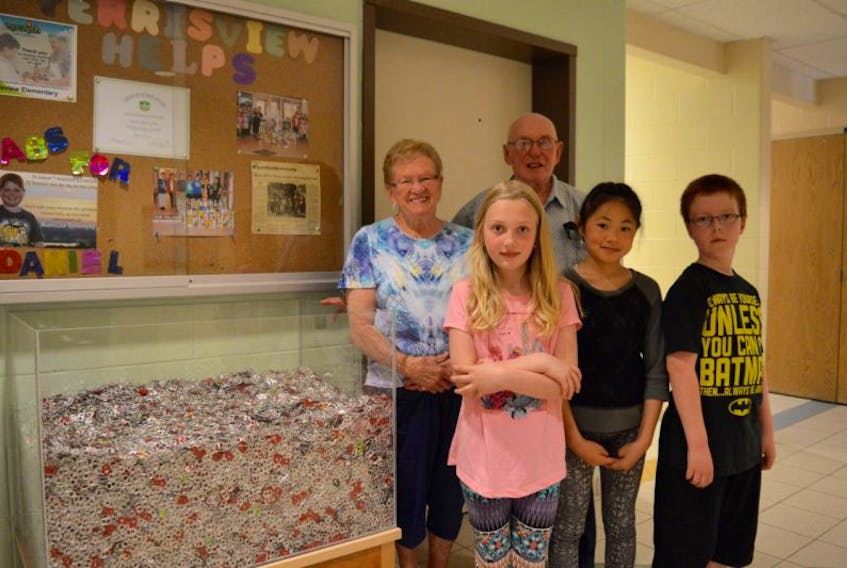 Jean and Alfred Landry are shown with Ferrisview Elementary School students, from left, Summer Scott, Jennifer Le and Liam Brown. Over the course of the school year, students and staff at the North Sydney school collected and donated tabs from aluminum cans. The Landrys collect the tabs on behalf of their grandson Daniel Aresneault of Trenton, who uses the tabs to raise money for children in need of wheelchairs across the province.