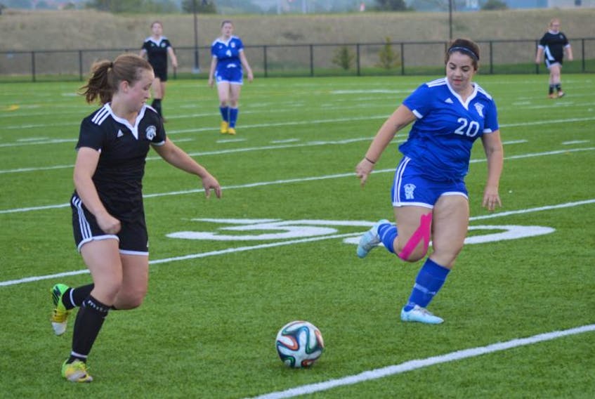 Sabrina Knox of the Glace Bay Panthers girls, left, is challenged by Cassidy Ferguson of the Sydney Academy Wildcats in Cape Breton High School Soccer League play Tuesday at Open Hearth Park turf in Sydney. The teams battled to a 1-1 draw.