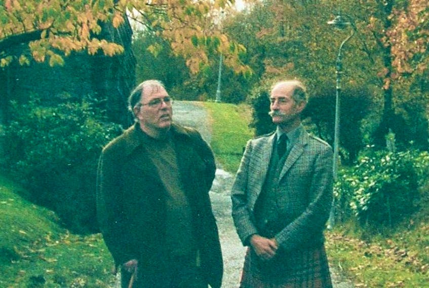 John G. Gibson, left, is shown compiling his research with Tearlach MacFarlane at a church in Glenfinnan, Scotland around 2001.