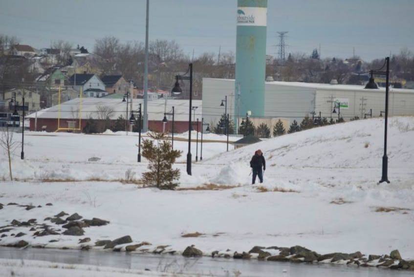 A hiker makes his way through Open Hearth Park in Sydney on a clear and partly cloudy Tuesday morning. The park might not be so clear over the next few days thanks to several weather systems heading towards Cape Breton.