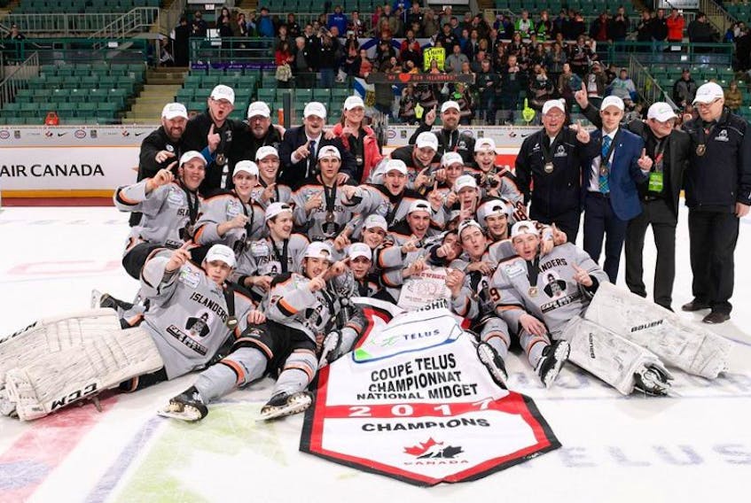 The Cape Breton West Islanders celebrate after winning the 2017 Telus Cup national midget hockey championship on Sunday in Prince George, B.C. The Islanders edged the Saint-François Blizzard of Quebec 5-4 in overtime.