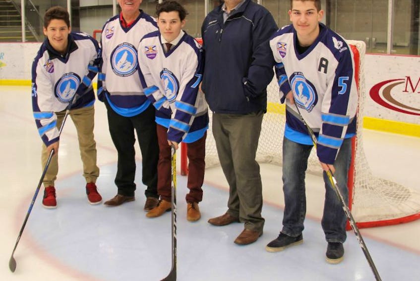 The Cape Breton Unionized Tradesmen will play at the Membertou Sport and Wellness Centre starting next season. From left are player Sonny Kabatay, Membertou Chief Terry Paul, player Ashton Paul, board member Ryan MacPherson and player Camdon Langlois on the ice in Membertou.