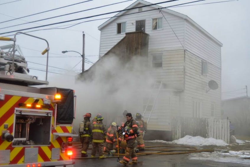Members of the Glace Bay, Reserve Mines and Dominion volunteer  fire departments battle a fire that broke out in a building that included five apartments and a barbershop, Friday morning. Glace Bay Fire Chief John Chant said there was substantial damage to the main floor, smoke and water damage to the second floor and smoke damage to the top floor.