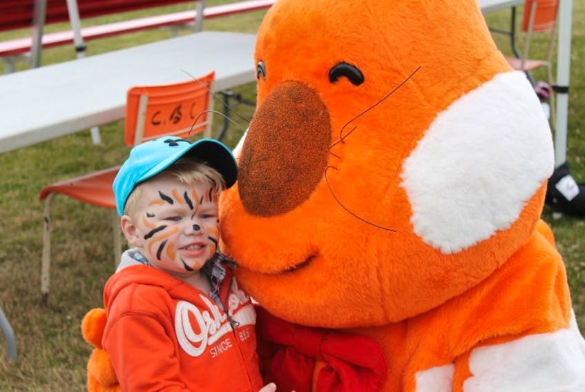 In this file photo, Benjamin Peterson is pictured with a mascot at last year’s Sydney Harbourfront festival, which has been reincarnated this year as the Waterfront Festival, with new organizers.
