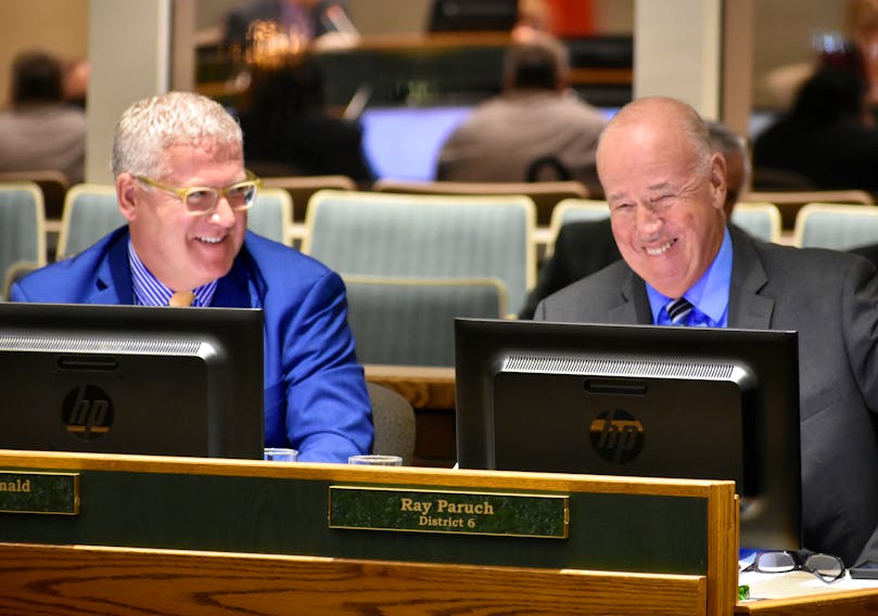 The late Ray Paruch, right, shares a laugh with CBRM Mayor Cecil Clarke prior to a council meeting in late 2018. DAVID JALA/CAPE BRETON POST