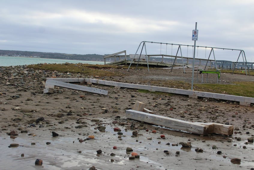 Along with overturned benches and bleachers at Indian Beach, there were many pieces of wooden and concrete parking lot dividers broken off during the Nov. 30 storm. The wheelchair accessible beach observation area in the back of this photo also appears to have been damaged on one side. NIKKI SULLIVAN/CAPE BRETON POST 