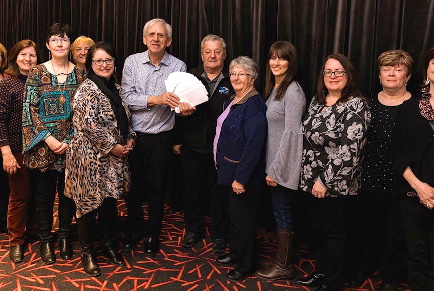 Members of 100 Women Who Care CBRM presented the North Sydney Food Bank Society with cheques totalling more than $10,000 during their last in-person at Casino Nova Scotia in Sydney on March 3. From left are 100 Women Who Care CBRM members Rose Westbury, Paulette McKenna, Margie Moore, Eileen McIntyre and co-founder Deana Lloy, along with Lawrence Shebib, John Oram and Karen Oram of the North Sydney Food Bank Society, as well as Shelley Bennett Trifos, Shelley Lund, Irene Carroll and Pat Foley of 100 Women Who Care CBRM. Contributed