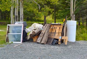 This photograph shows a typical pile of stuff, including an old window, discarded barbecue, bed frame and hot water tank, left out beside an area road for the Cape Breton Regional Municipality’s annual heavy garbage curbside collection. This year’s pick-up has been delayed due to COVID-19. The service begins Sept. 28. DAVID JALA/CAPE BRETON POST