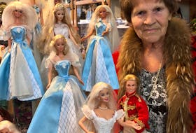 Madonna Porter of C.B.S. poses with some of the Barbie dolls in her large collection — a collection that she is donating today to Branch 1 of the Royal Canadian Legion in St. John's. "My dream is coming true," Porter says of donating her collection to a worthy cause.