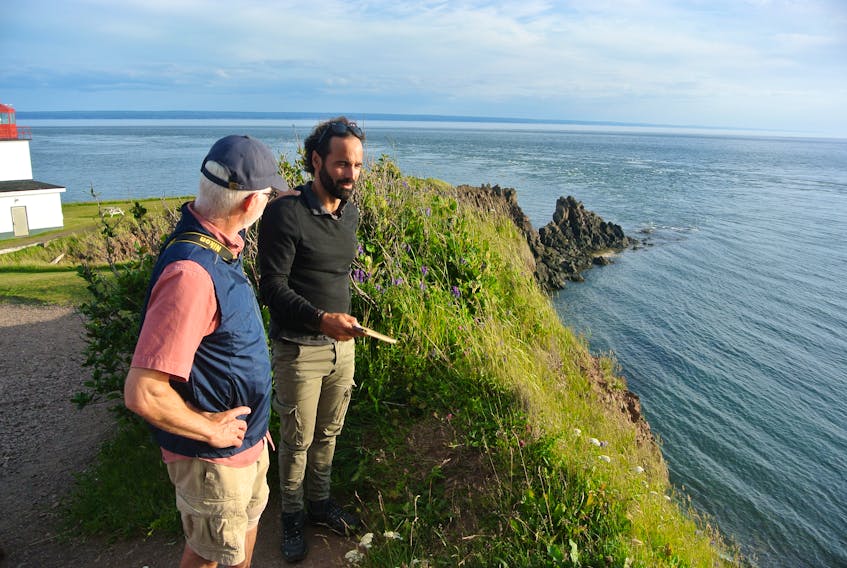 John Calder speaks to UNESCO scientist Asier Hilario during a visit to Cape d’Or near Advocate Harbour last July. Hilario and Nikolaos Zourous spent several days in the area evaluating the Cliffs of Fundy Aspiring Global Geopark application for UNESCO. A decision on the application has been postponed due to concerns over the spread of the coronavirus. File