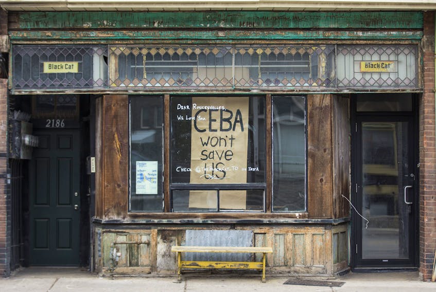 A storefront with the message "CEBA won't save us", along Dundas St. W., near Roncesvalles Ave. Toronto, Ont on Thursday April 23, 2020.  This is referring to the Canada Emergency Business Account.  