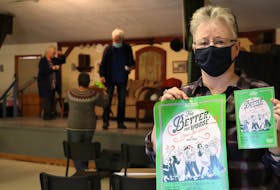 Mary Ellen Callaghan holds the poster and play book for the Benevolent Irish Society's St. Patrick's Day play, For Better, For Worse, by Jimmy Keary.