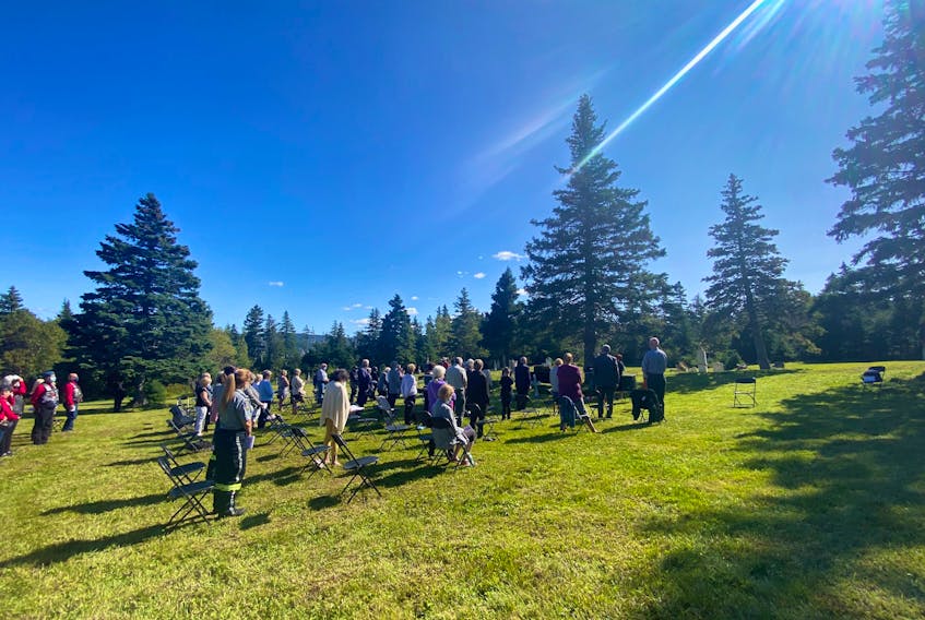 A small crowd gathered at North Side Cemetery in Holyrood to celebrate the restoration of a gravesite for Capt. Thomas Dwyer, a veteran of the First World War. - Submitted photo