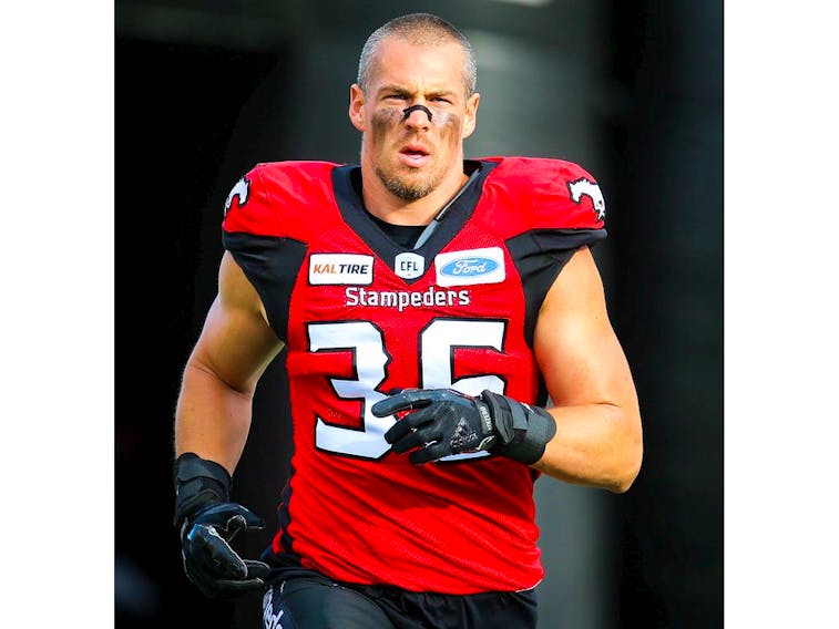 Cory Greenwood of the Calgary Stampeders runs onto the field during player introductions before facing the Toronto Argonauts in CFL football on Thursday, July 18, 2019. Al Charest/Postmedia