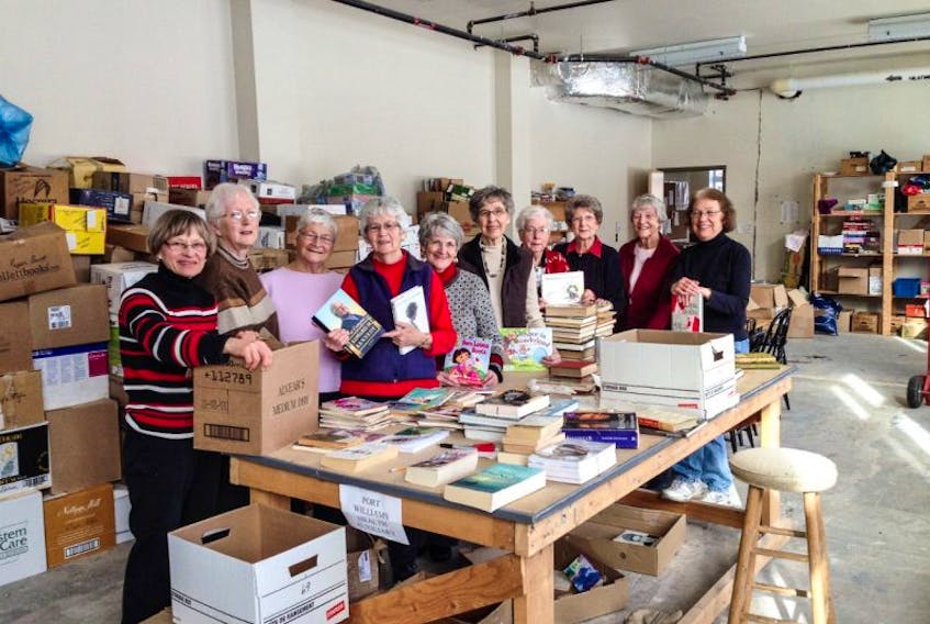 <p>There are plenty of books available at the CFUW annual book sale. Lee Brannen, left,&nbsp;Gerri Robertson, Winnie Horton, Marian Sampson, Judy Amos, Eleanor Palmer, Lois Forsman, Jacqueline Connelly, Pat Angela, and Lesley Vaughan set up some of the books that will be available. - Submitted</p>