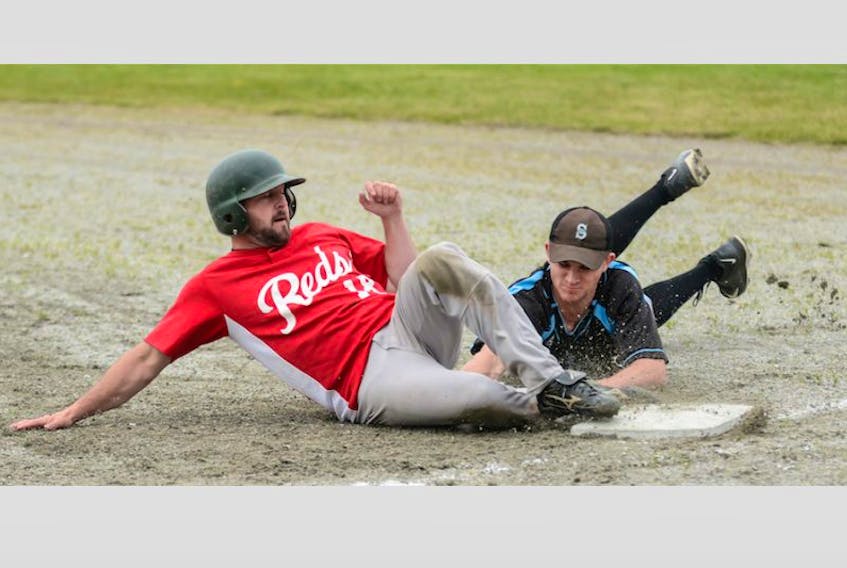 The dirt was flying on this close base play during a Schooners vs southwestern league ‘legends' game in Clark’s Harbour.