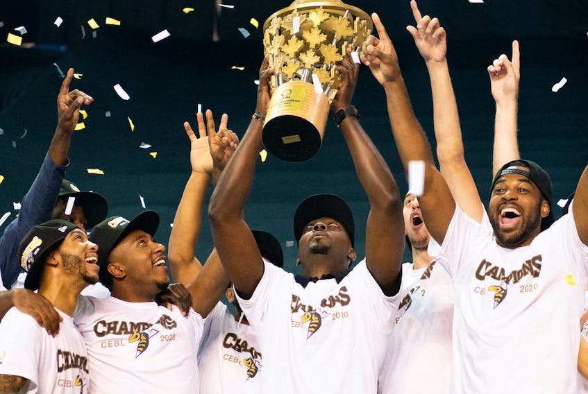 Edmonton Stingers head coach Jermaine Small lifts the Canadian Elite Basketball League championship trophy after a 90-73 win against the Fraser Valley Bandits in the CEBL Summer Series final at the Meridian Centre in St. Catharines, Ont., on Aug. 9, 2020.