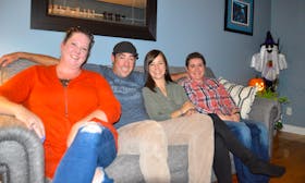 Glenn Paruch, second from right, is the new councillor for District 6 in the Cape Breton Regional Municipality. He succeeds his late father Ray for the council seat and he's shown celebrating with family at his Sydney home. From left are sister Nadine Paruch, wife Melissa Paruch, Paruch, and sister-in-law Brenda Hall. GREG MCNEIL/CAPE BRETON POST  