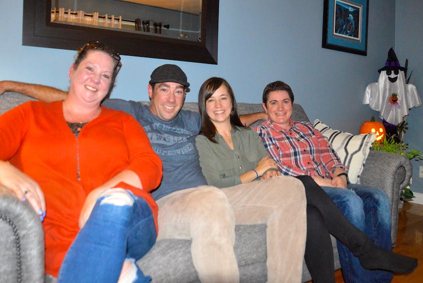 Glenn Paruch, second from right, is the new councillor for District 6 in the Cape Breton Regional Municipality. He succeeds his late father Ray for the council seat and he's shown celebrating with family at his Sydney home. From left are sister Nadine Paruch, wife Melissa Paruch, Paruch, and sister-in-law Brenda Hall. GREG MCNEIL/CAPE BRETON POST  