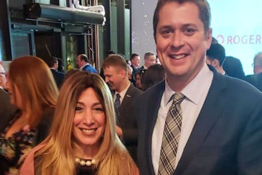 Chani Aryeh-Bain with Andrew Scheer. The Conservative candidate for a seat in Toronto is seeking to have the federal voting day moved because it falls on a Jewish holiday.
