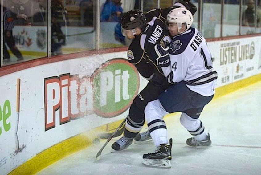 Rimouski Oceanic defenceman Charles-Edouard D'Astous hits Charlottetown Islanders Alexis Vanier during Tuesday' Game 3 of their Quebec Major Junior Hockey League playoffs.
