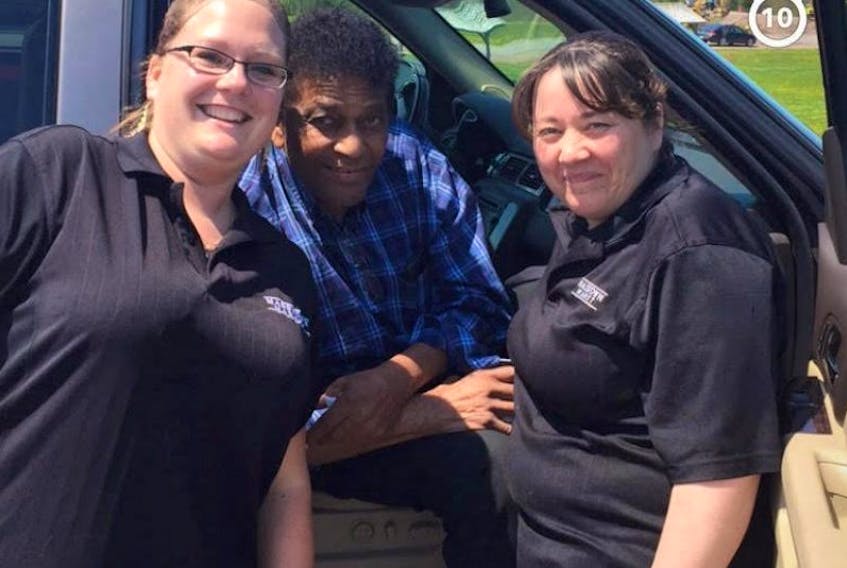 American country singer Charlie Pride was kind enough to pose for a photo with Cathy Burgess and Dayna Snook, staff at the Masstown Market, on Thursday.