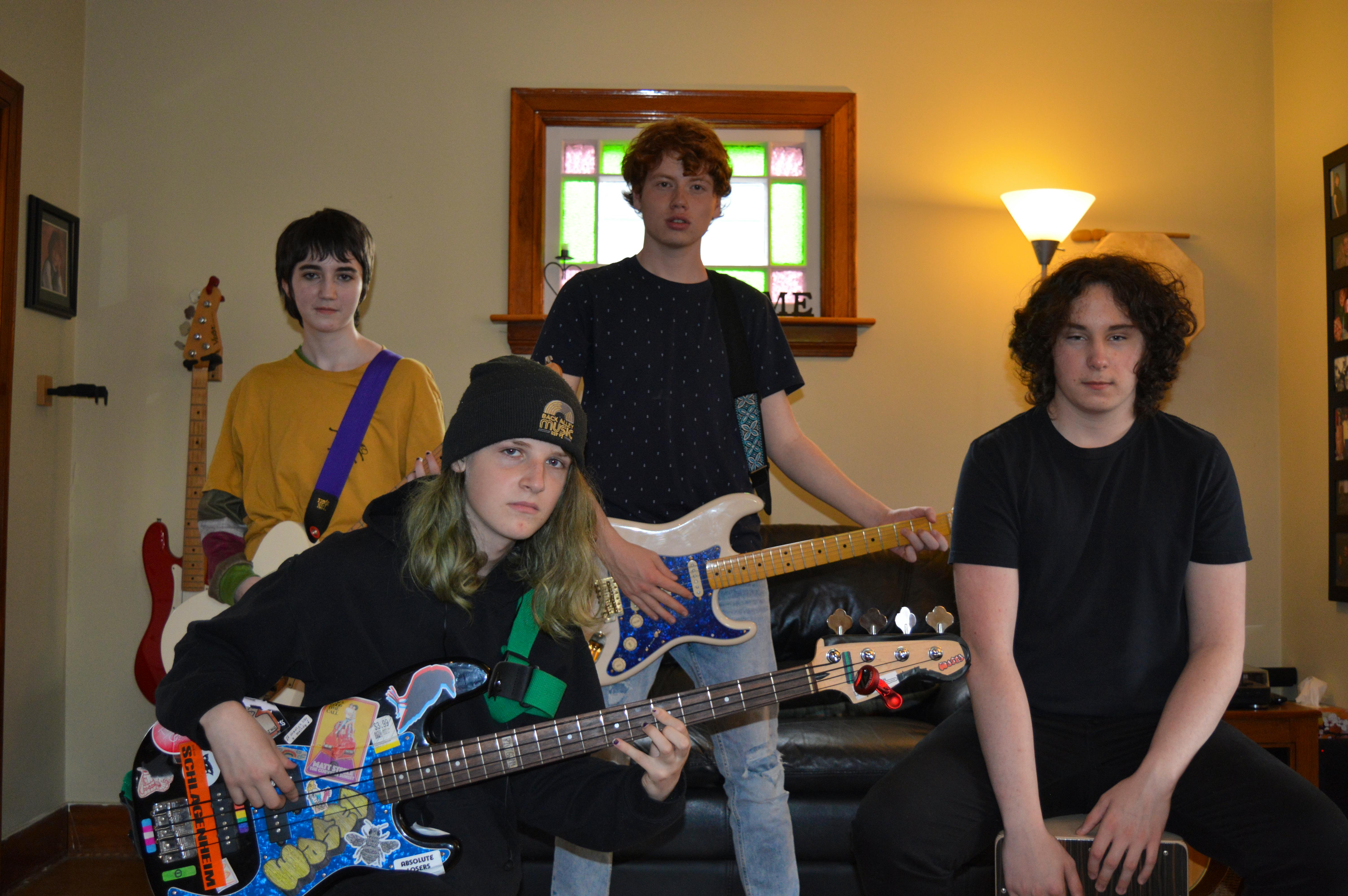 Members of Moment of Eclipse are, front row, Charlotte Lloyd, bass; and Jesse MacCormac, drums. Back row, Casey Mann, guitar; and Nicholas Dickieson, lead singer. The band just released its first single, Obsessive, Compulsive.
