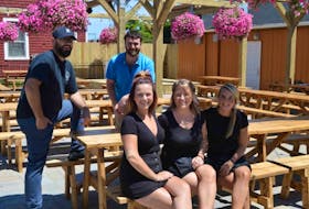 <p>Staff at Charlottetown’s first beer garden were busy on Wednesday getting ready for the grand opening today. Sitting, from left, are Meredith Hines, Karen Brown and Kate Dalziel. Standing are co-owner Steve Barber, left, and Luke Kenny, manager.</p>
<p>&nbsp;</p>