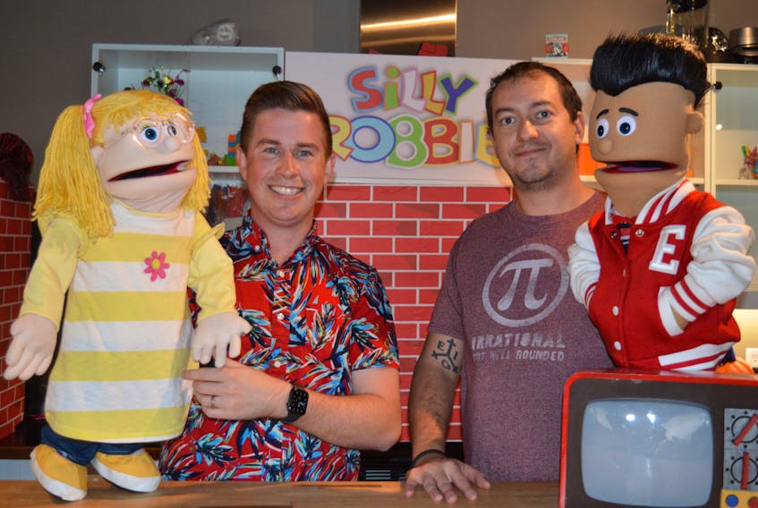 Robbie Doherty, left, and Jesse Wachter, are seen on the set of Silly Robbie’s World with two of the characters in the show, Lucky and Eddie, respectively. Silly Robbie’s World airs each Saturday on Eastlink Community TV.