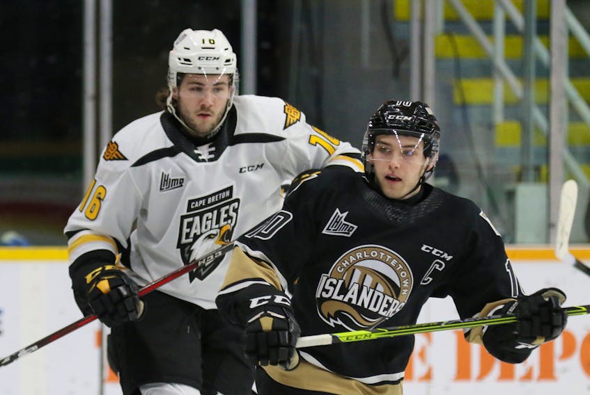 Cape Breton Eagles forward Félix Paré, left, keeps a close eye on Charlottetown Islanders captain Brett Budgell during a Québec Major Junior Hockey League match played on Saturday afternoon at Centre 200 in Sydney. Budgell scored two goals and added two assists to lead the Islanders to a 6-3 victory over the Eagles. Mike Sullivan Photo