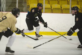 Charlottetown Bulk Carriers Knights’ left-winger Simon Hughes, centre, breaks in on defenceman Marshall Gallant while Drew MacPhee joins the rush during Tuesday’s practice at MacLauchlan Arena. Jason Malloy/The Guardian