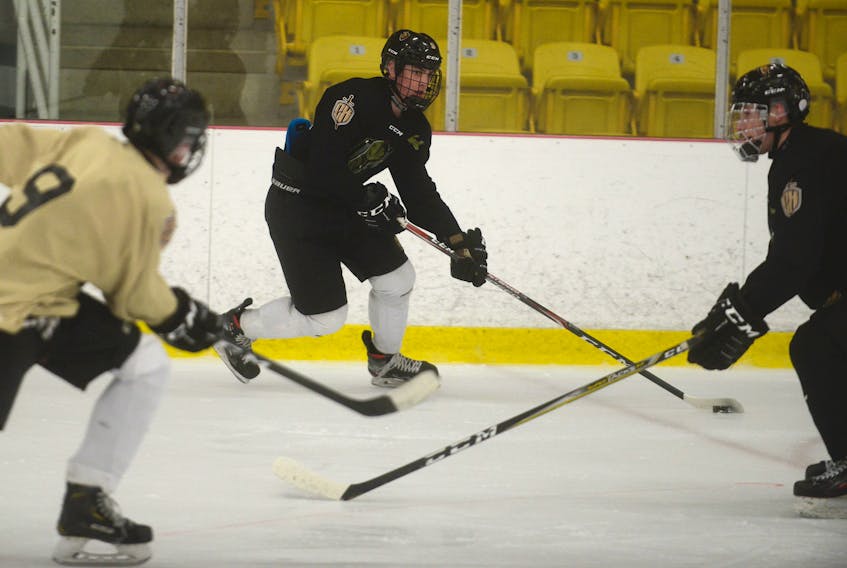 Charlottetown Bulk Carriers Knights’ left-winger Simon Hughes, centre, breaks in on defenceman Marshall Gallant while Drew MacPhee joins the rush during Tuesday’s practice at MacLauchlan Arena. Jason Malloy/The Guardian