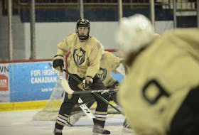 Cameron MacLean provides the screen and looks to tip a shot during a recent Charlottetown Bulk Carriers Knights practice. 