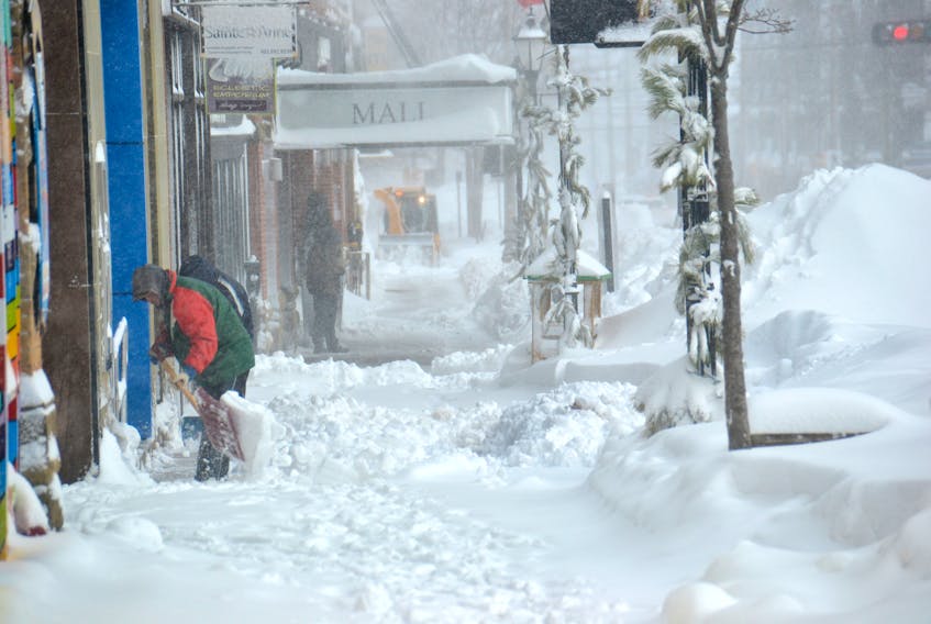 Residents of Charlottetown begin to dig themselves out after a snowstorm overnight on Sunday. Schools were cancelled across the Island and many downtown businesses remained closed for the day as of 10 a.m.