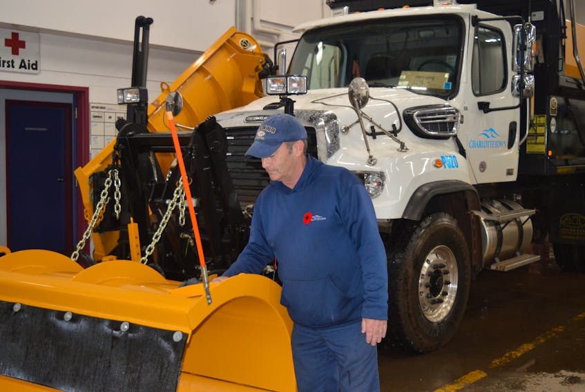 Craig Campbell, one of Charlottetown’s snowplow drivers, gives one of the trucks in the city’s public works fleet a good buffing before hitting the road last winter.