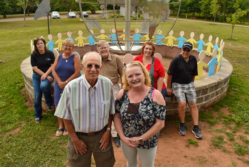 International Children's Memorial Place founder Bill MacLean, front left, is shown with P.E.I. Cupcakes leader Samantha MacPherson, who visited the site recently. Also shown are Toby MacDonald, back left, ICMP board member Dianne MacLean, ICMP president Maitland MacIsaac, Michelle Noonan and ICMP board member David Blanchard.