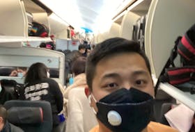 Kevin Zhao snaps a selfie on the last Air Canada flight from China to Canada. CONTRIBUTED PHOTO