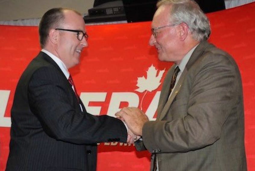 <p>Chris Palmer, left, shakes hands with Premier Wade MacLauchlan after being elected the Liberal party's nominee for the District 21, Summerside-Wilmot, byelection.</p>
<p>&nbsp;</p>