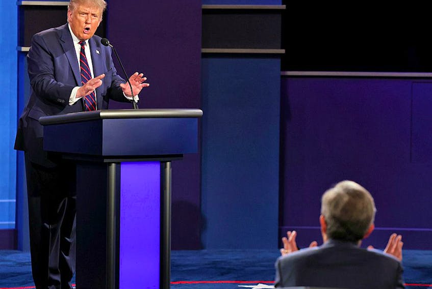 President Donald Trump argues with debate moderator Chris Wallace of Fox News Channel during the first 2020 presidential campaign debate, September 29, 2020.   