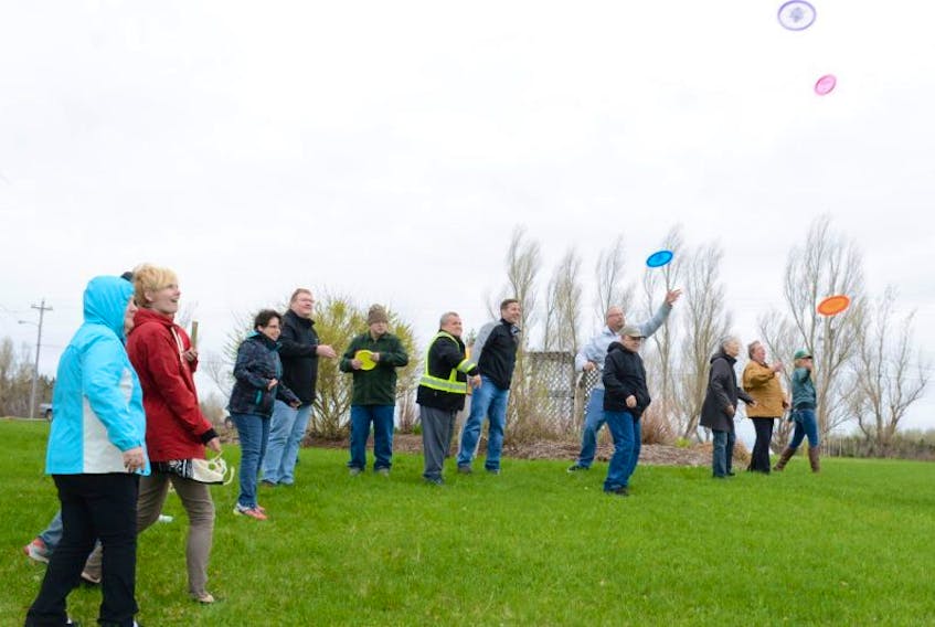It was a day of celebration in Pugwash when staff and clients at the Sunset Community recently tossed discs to ring in the naming of the Denis Brown Memorial nine-hole disc golf course in Pugwash. 
