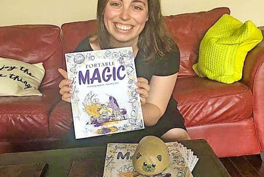 Alexandra Theroux sits with her newly released colouring book. The former Truemanville resident has published a book following the adventures of her pug rock.