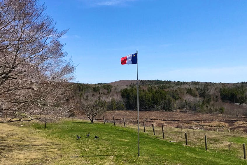 Gilles Desautels is a proud Acadian. His flag flies at his home in Meteghan, River N.S. The Acadian flag was designed in 1965 by Thomas J. Arceneaux.
