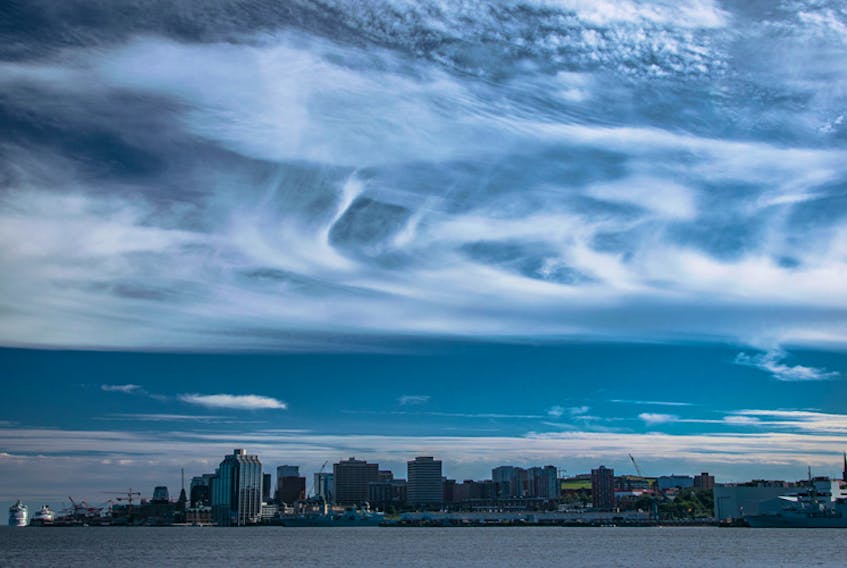 Stunning late summer sky over the Halifax Harbour.  When Brian Gomes noticed these magnificent clouds just hours before the fall equinox, he wondered if the cruise ship passengers were also taking in the view. - Brian Gomes