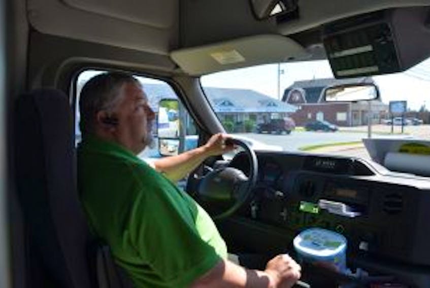['Trius Transit driver Chris Melanson drove the first official route Tuesday for Summerside’s new public transportation system. Although he only picked up about a dozen passengers – some who rode for free – the Summerside native says residents will get used to the service.']