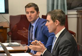 Sidney MacEwen (right) speaking during a standing committee meeting on Wednesday. MacEwen said he believes it is “frustrating” for the public to hear that Mix’ e-mails cannot be found