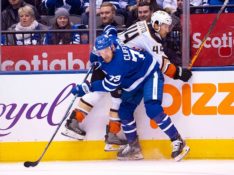 Toronto Maple Leafs left wing Kyle Clifford  battles along the boards with Anaheim Ducks defenceman Michael Del Zotto during the first period at Scotiabank Arena in Toronto on Friday, Feb. 7, 2020. 